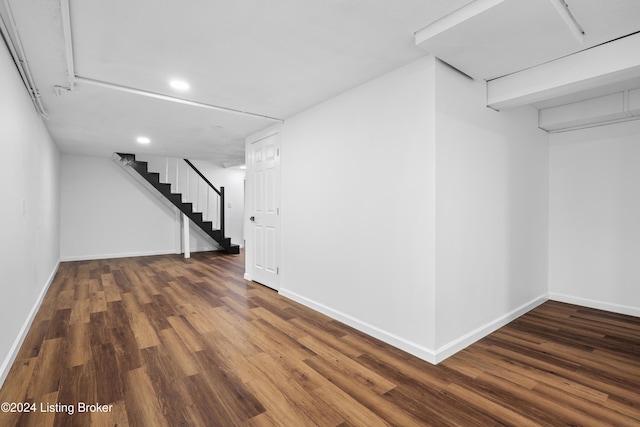 basement featuring dark hardwood / wood-style flooring