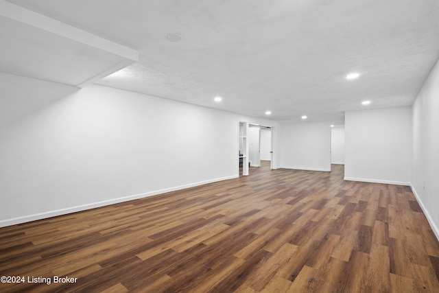 basement featuring dark wood-type flooring