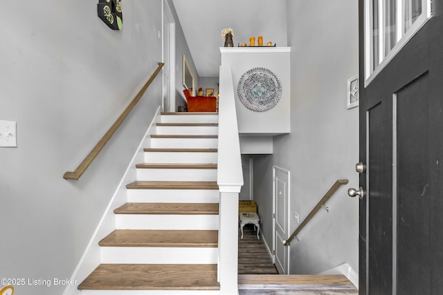 stairs with wood-type flooring