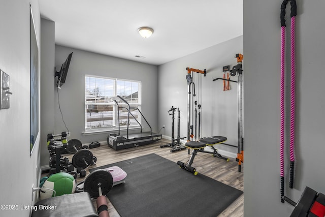 workout room with hardwood / wood-style flooring