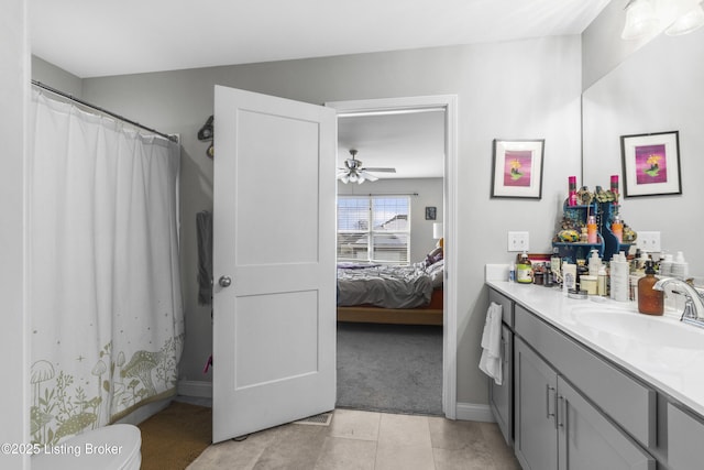 bathroom with tile patterned floors, vanity, toilet, and a shower with shower curtain