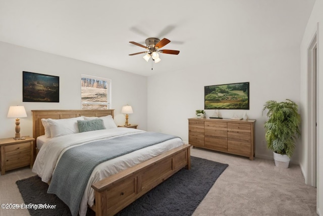 bedroom with light colored carpet and ceiling fan