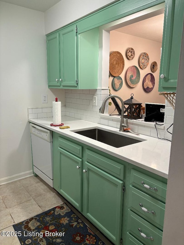 kitchen featuring sink, green cabinets, and dishwasher