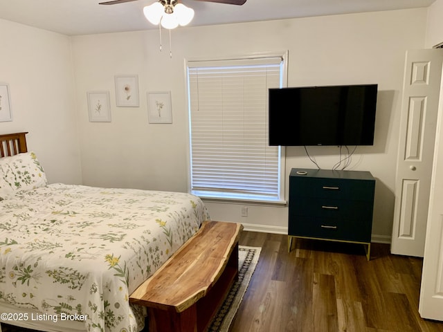 bedroom featuring ceiling fan and dark hardwood / wood-style flooring