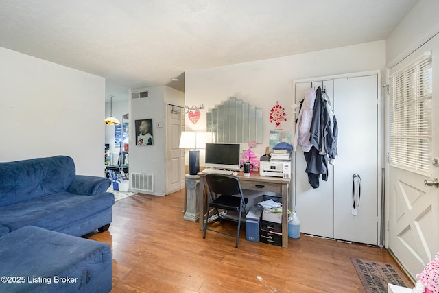 home office featuring hardwood / wood-style floors