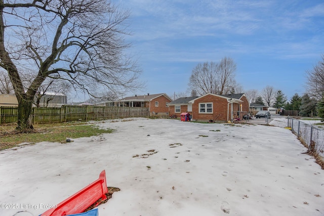 view of yard covered in snow