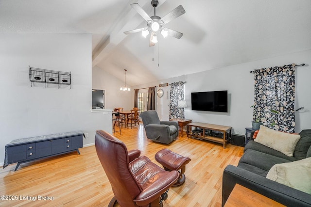 living room with ceiling fan with notable chandelier, light hardwood / wood-style flooring, and vaulted ceiling with beams