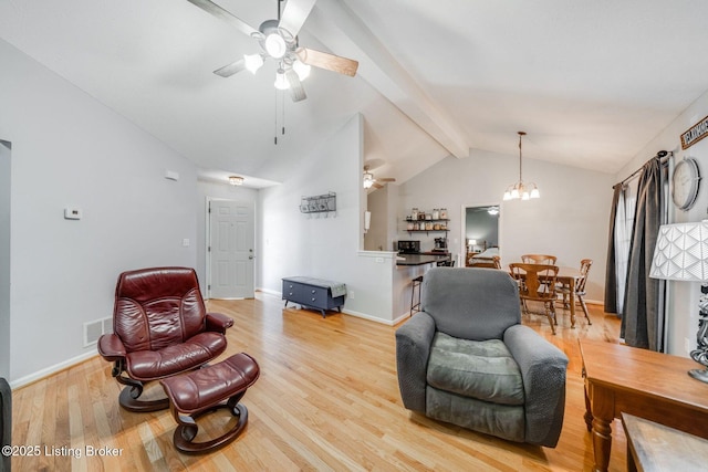 living room featuring light hardwood / wood-style floors, lofted ceiling with beams, and ceiling fan with notable chandelier