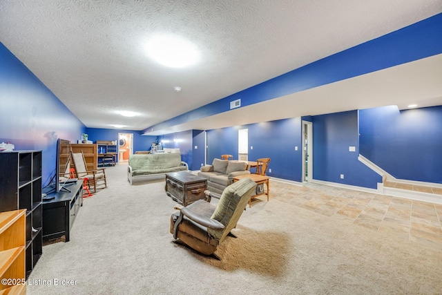 living room featuring carpet floors and a textured ceiling