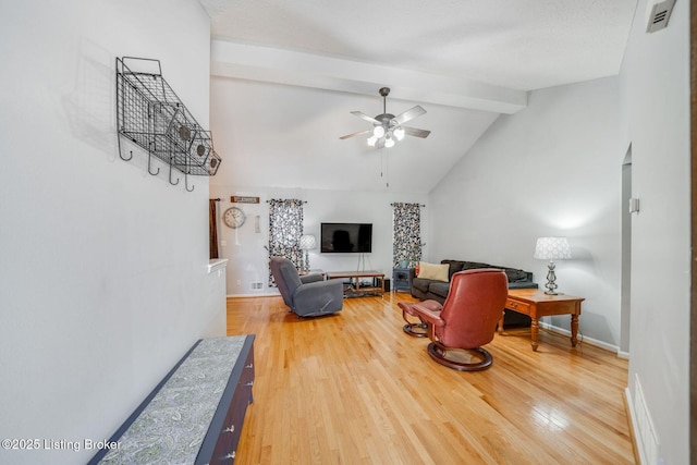 living room featuring hardwood / wood-style flooring, beam ceiling, high vaulted ceiling, and ceiling fan