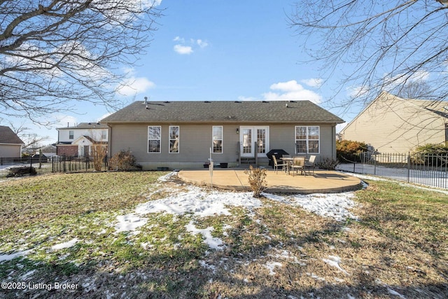 rear view of property with a patio area, a yard, and french doors