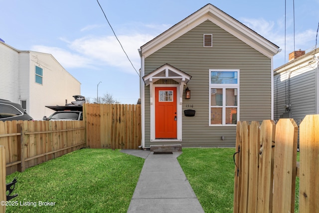 bungalow-style house featuring a front yard