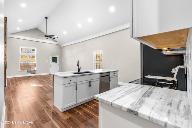 kitchen featuring dishwasher, stove, sink, white cabinetry, and light stone countertops