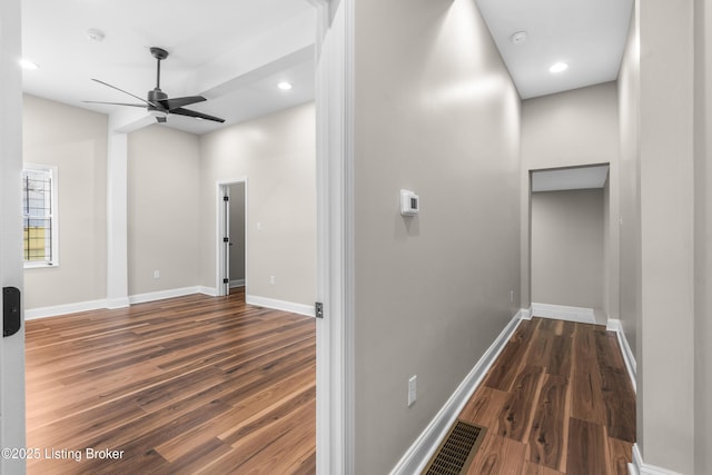 corridor with dark wood-type flooring