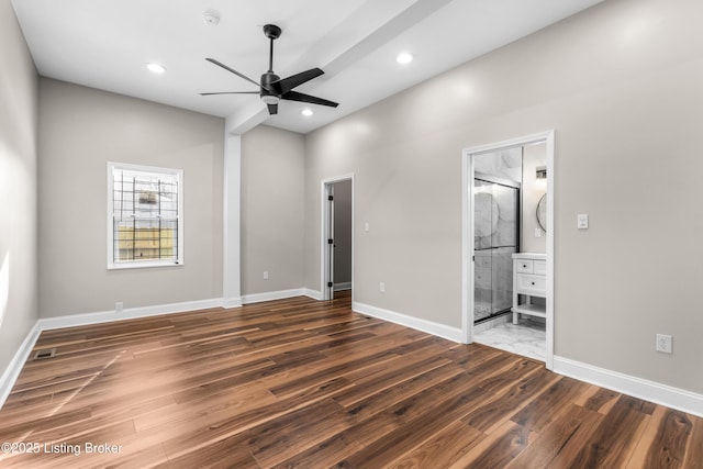 unfurnished bedroom with ceiling fan, dark hardwood / wood-style floors, and ensuite bath