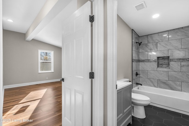 full bathroom with tile patterned floors, toilet, vanity, and tiled shower / bath