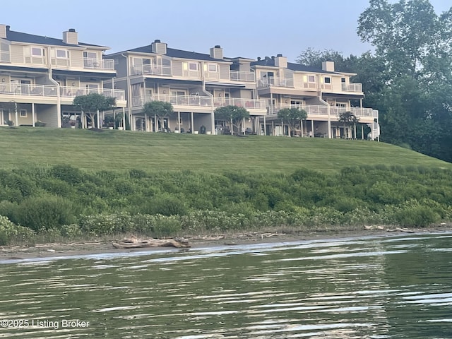 view of home's community with a water view