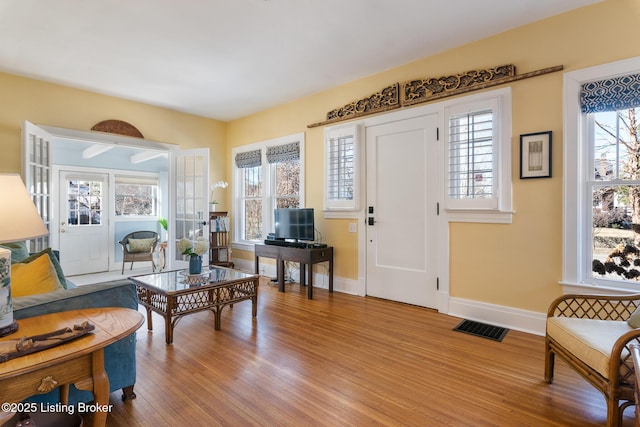 interior space featuring a healthy amount of sunlight and light hardwood / wood-style floors