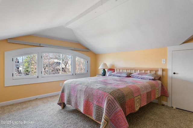 carpeted bedroom featuring multiple windows and vaulted ceiling