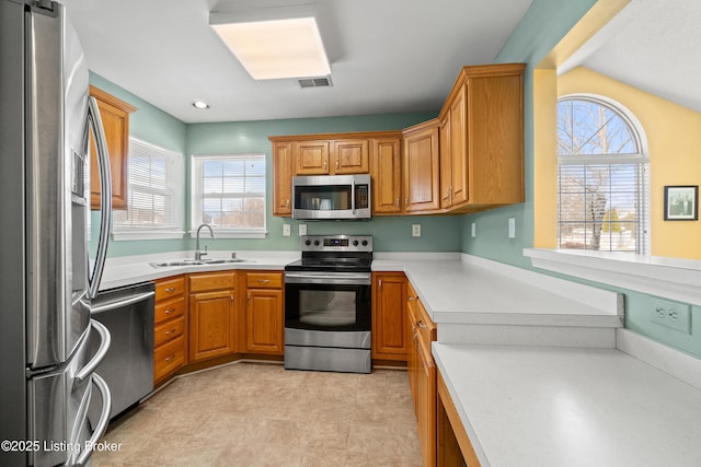 kitchen featuring stainless steel appliances and sink