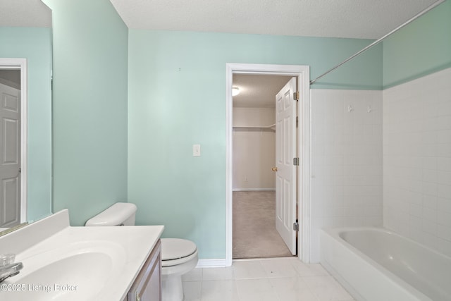 full bathroom featuring shower / washtub combination, tile patterned flooring, vanity, toilet, and a textured ceiling