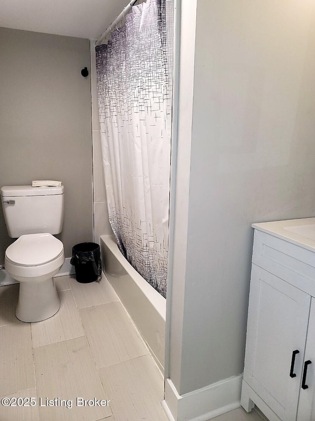 full bathroom featuring vanity, toilet, and shower / bath combo with shower curtain