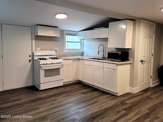 kitchen with white cabinetry, sink, dark wood-type flooring, and white gas range oven