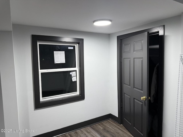 interior space with dark wood finished floors and baseboards