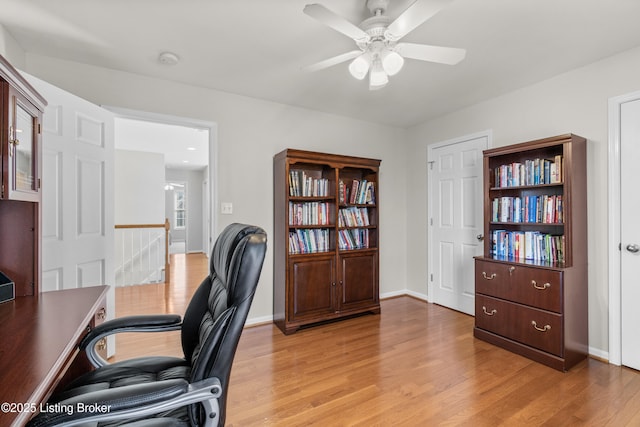 home office featuring ceiling fan and light wood-type flooring