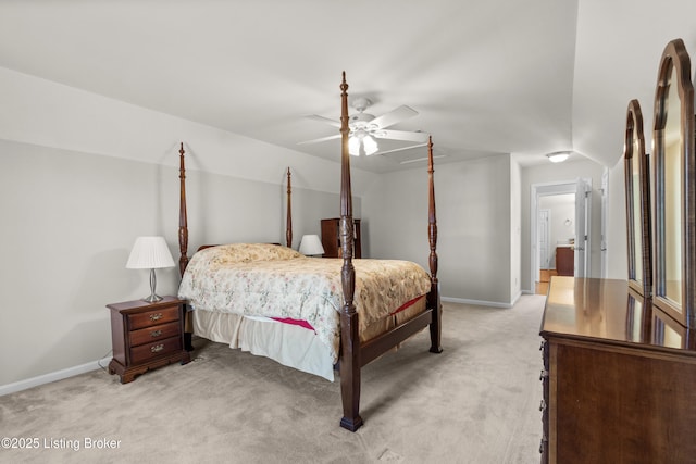 bedroom with ceiling fan and light carpet