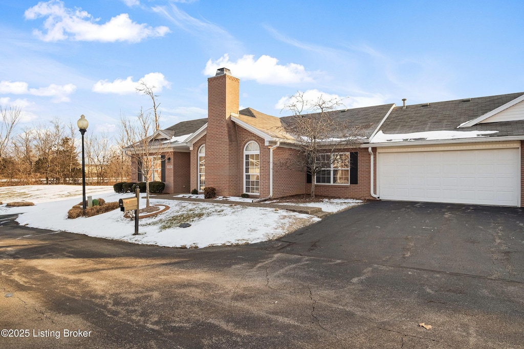 ranch-style home with a garage