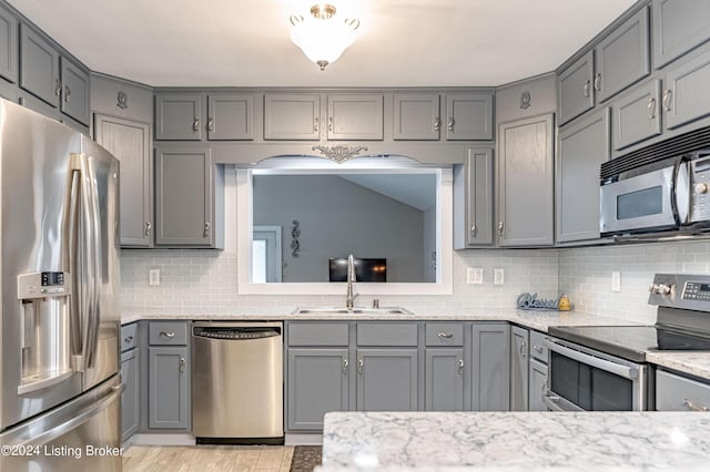 kitchen featuring gray cabinetry and stainless steel appliances