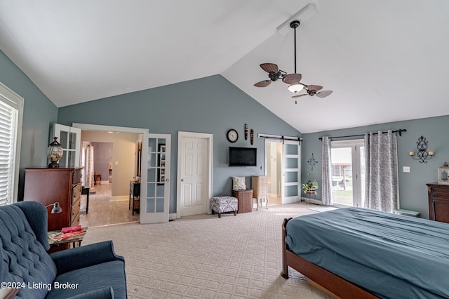 carpeted bedroom featuring ceiling fan, a barn door, and high vaulted ceiling