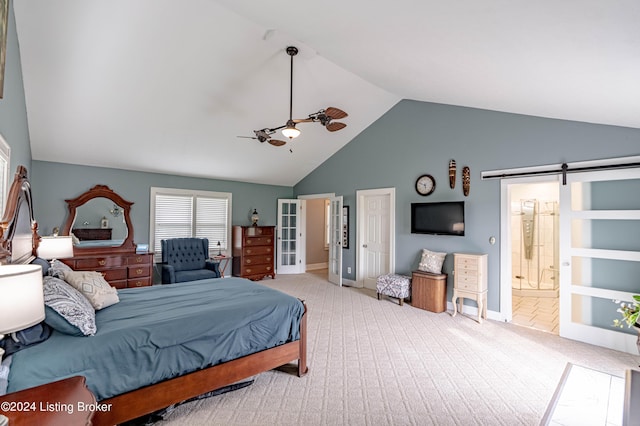 carpeted bedroom featuring ceiling fan, ensuite bath, a barn door, and vaulted ceiling