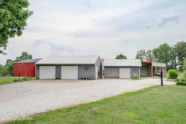 garage featuring a lawn