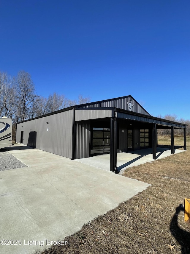 view of side of property with a carport