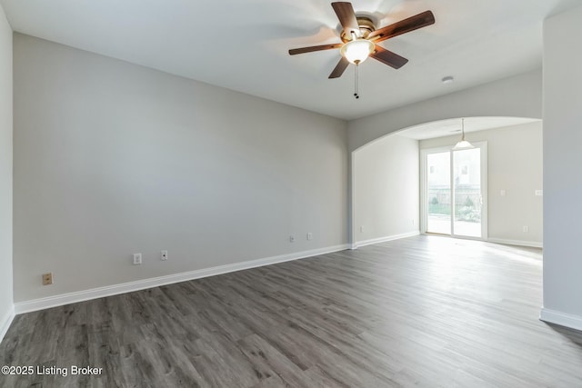 spare room with ceiling fan and hardwood / wood-style floors