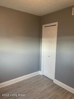 spare room featuring light wood-type flooring