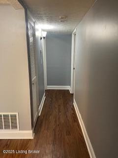 hall featuring dark wood-type flooring