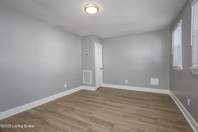 spare room with light wood-type flooring