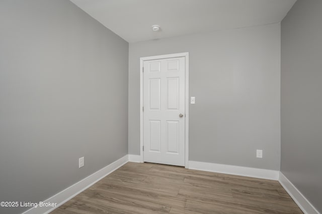 spare room featuring light hardwood / wood-style flooring