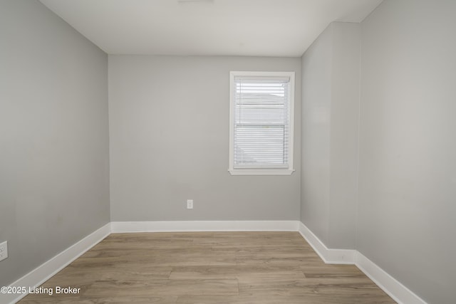 unfurnished room with light hardwood / wood-style flooring