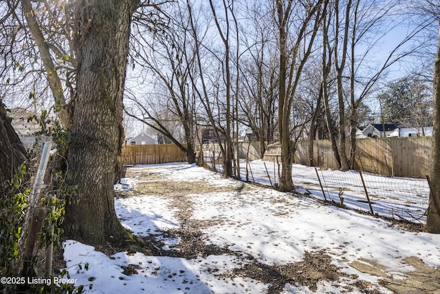 view of yard layered in snow