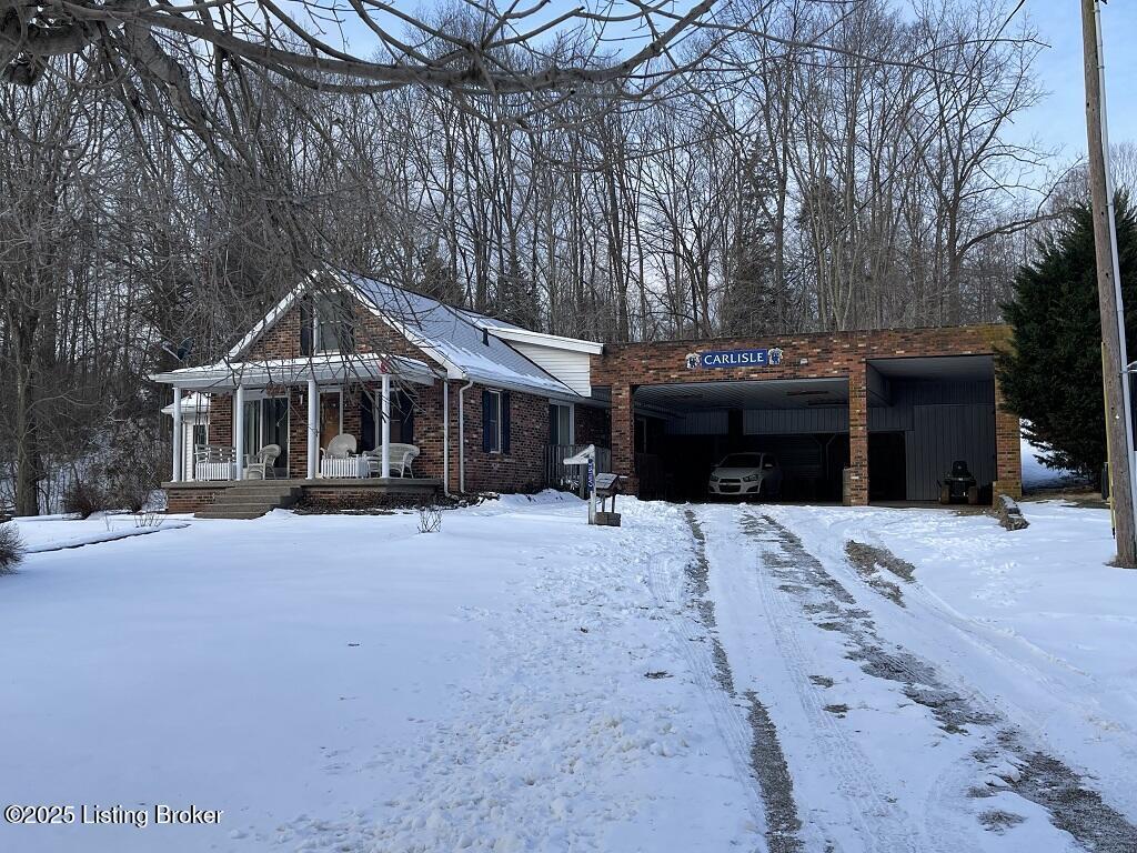 view of front of house with a porch and a garage