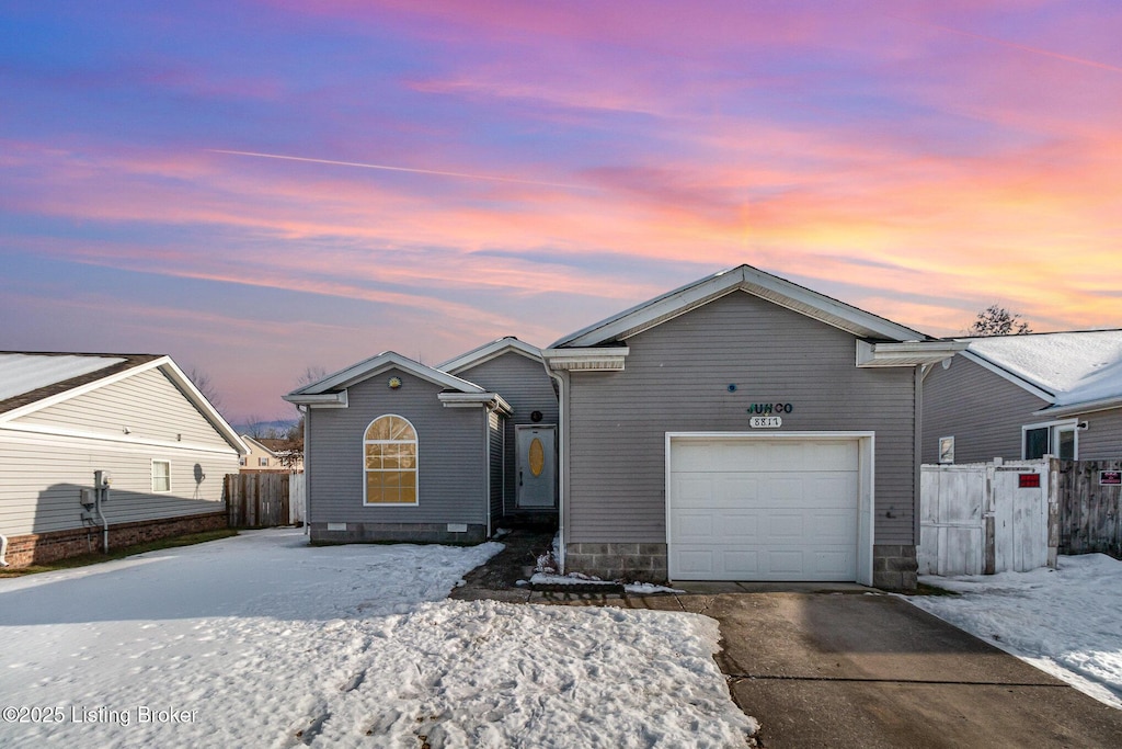 ranch-style home with a garage