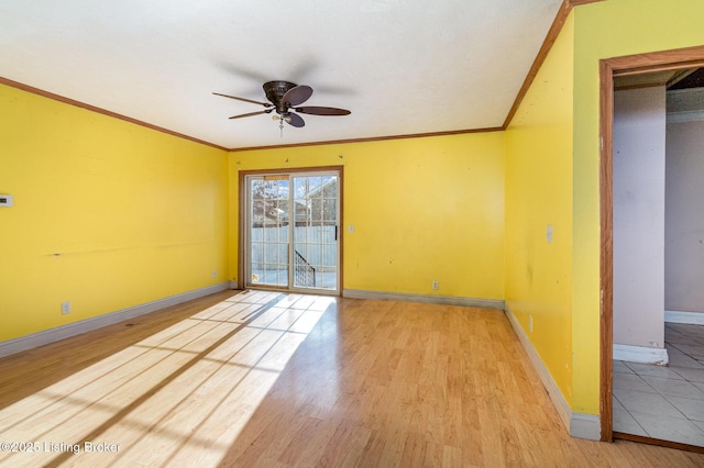 unfurnished room featuring ceiling fan, crown molding, and light hardwood / wood-style flooring