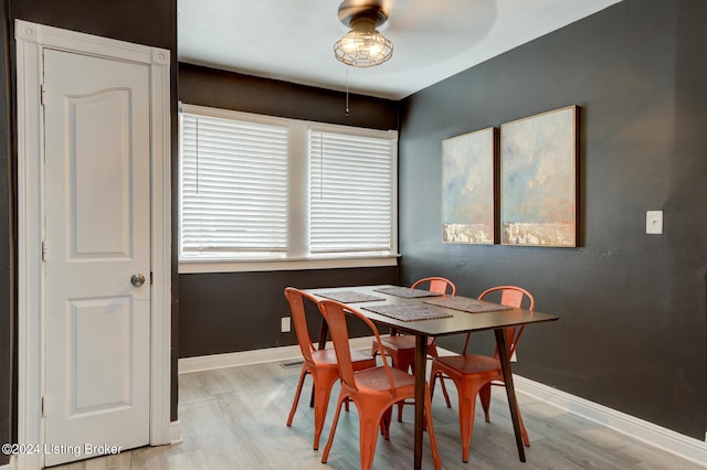 dining space featuring light hardwood / wood-style floors