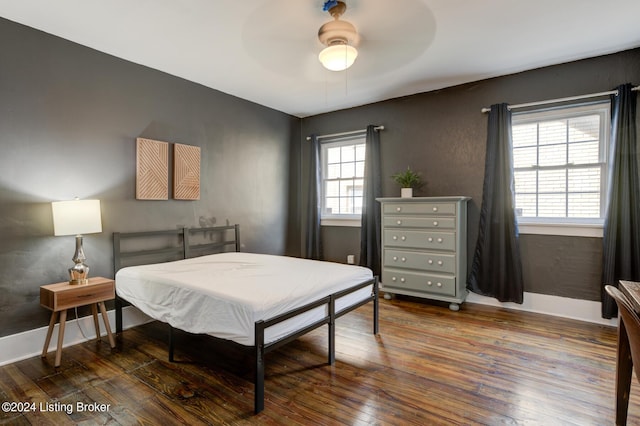 bedroom featuring ceiling fan and dark hardwood / wood-style floors