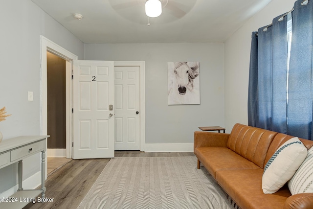 sitting room featuring ceiling fan and light hardwood / wood-style floors