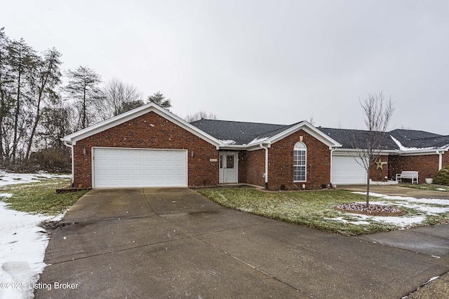 single story home featuring a front yard and a garage